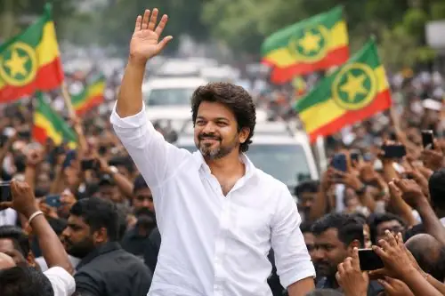 Actor Vijay addressing supporters during a political rally representing the TVK Party movement